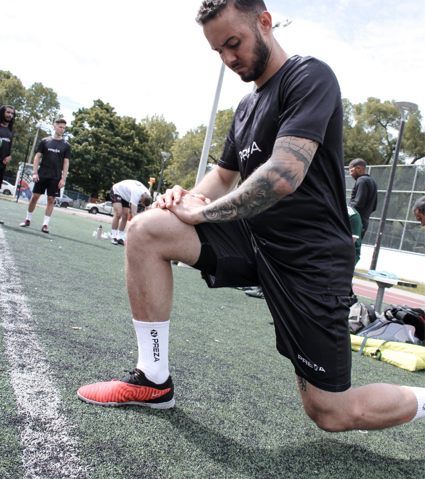 Model showcasing a Preza Grip Sock while stretching 